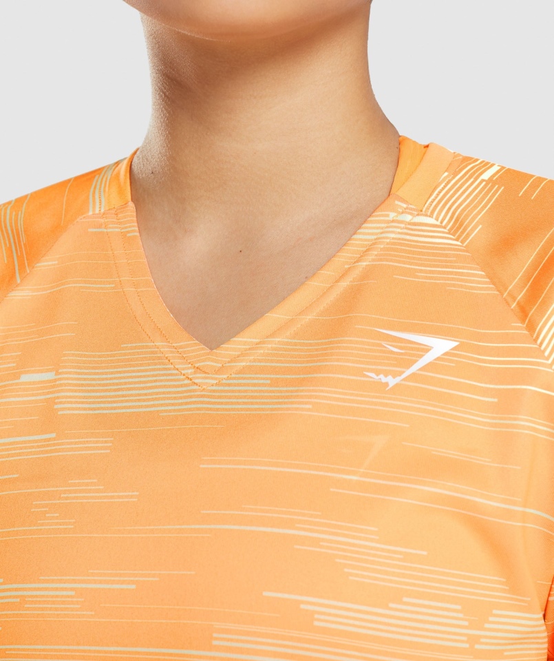 Gymshark Sportowa Koszulka Midi Pomarańczowy Nadruk